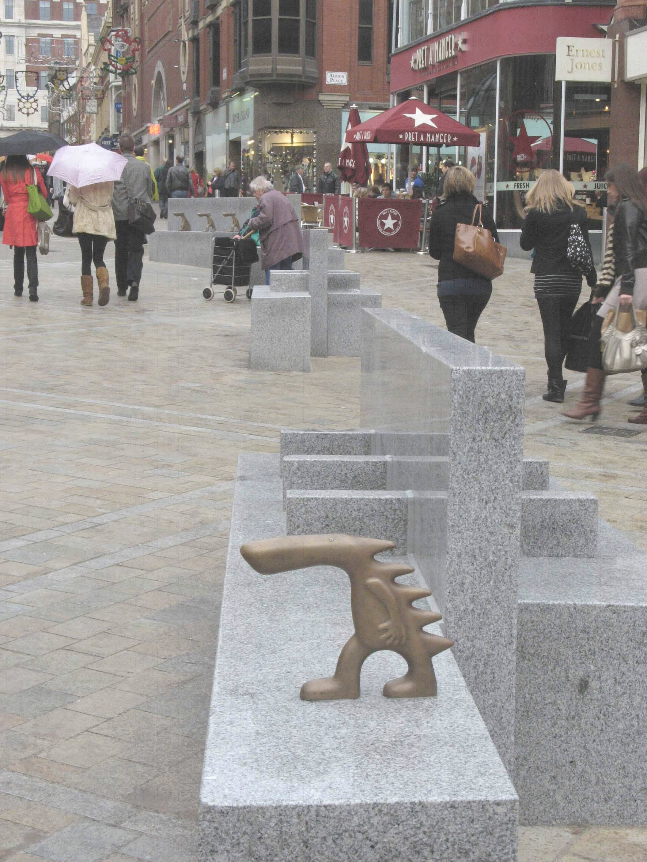 Bronze arms rest, Leeds city centre.